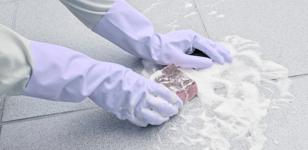 Clean the hotel bathroom floors.
